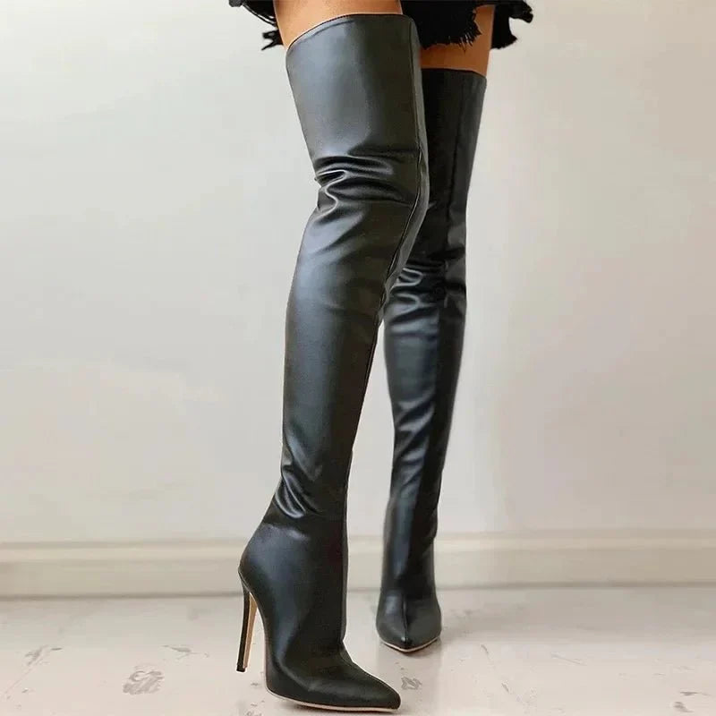 Sophisticated women's black over-the-knee stiletto boots with a pointed toe & slim fit, ideal for party wear.