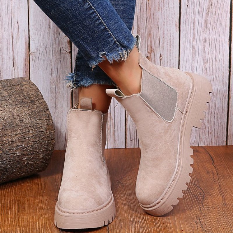 Women's black platform Chelsea boots with elastic panels for modern street style. Chunky sole ankle boots.