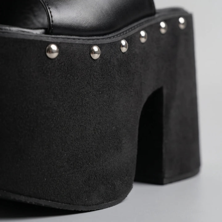 Stylish women's black platform slip-on sandals, featuring a comfortable high block heel & open toe design.