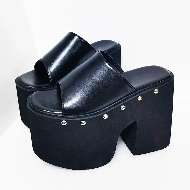Chic women's black platform high-heel sandals with a sturdy block heel and easy slip-on open-toe design.