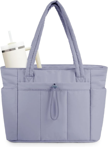 Modern women's puffer tote, travel-ready, with laptop sleeve & quick-access cup holder.