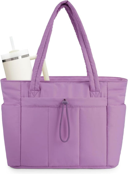 Organized women's quilted tote for the office, featuring a laptop sleeve & a handy cup holder.