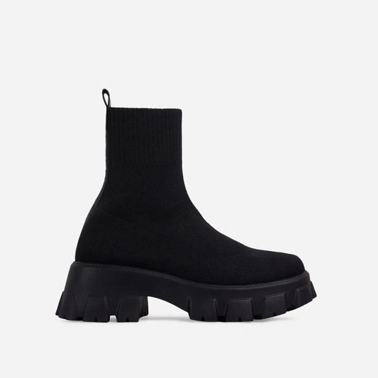 Women's black slip-on ankle boots, chic & comfortable for effortless everyday fashion.