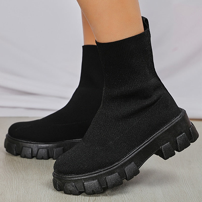 Fashionable women's slip-on ankle boots, offering effortless style & comfort for daily wear.