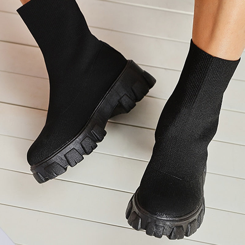Chic women's slip-on ankle boots, designed for comfort and trendy casual styling.