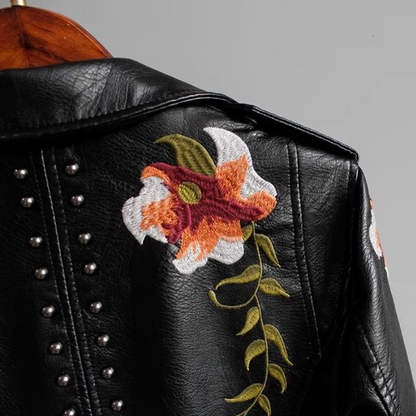 Edgy women's statement jacket: studded biker style with beautiful floral embroidery, a must-have outerwear piece.