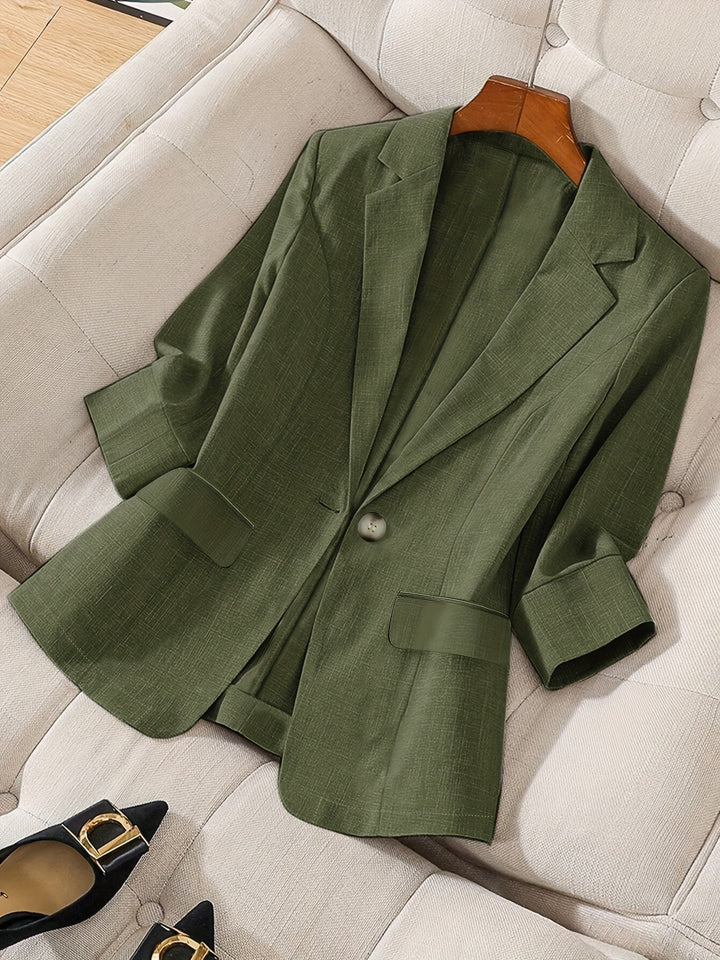 Elegant navy cropped blazer for women. Tailored jacket, ideal for modern office wear & versatile business style.
