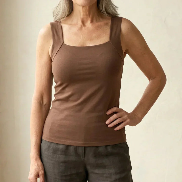 Women's black tank top with built-in wire-free bra for all-day comfort and support.