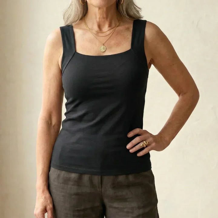 Breathable women's tank top with built-in bra, excellent for summer comfort and layering.
