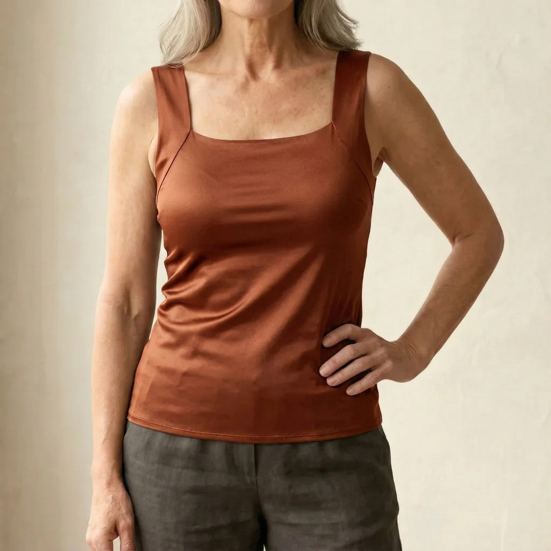 Versatile white women's comfort tank with built-in bra, great for everyday wear and support.
