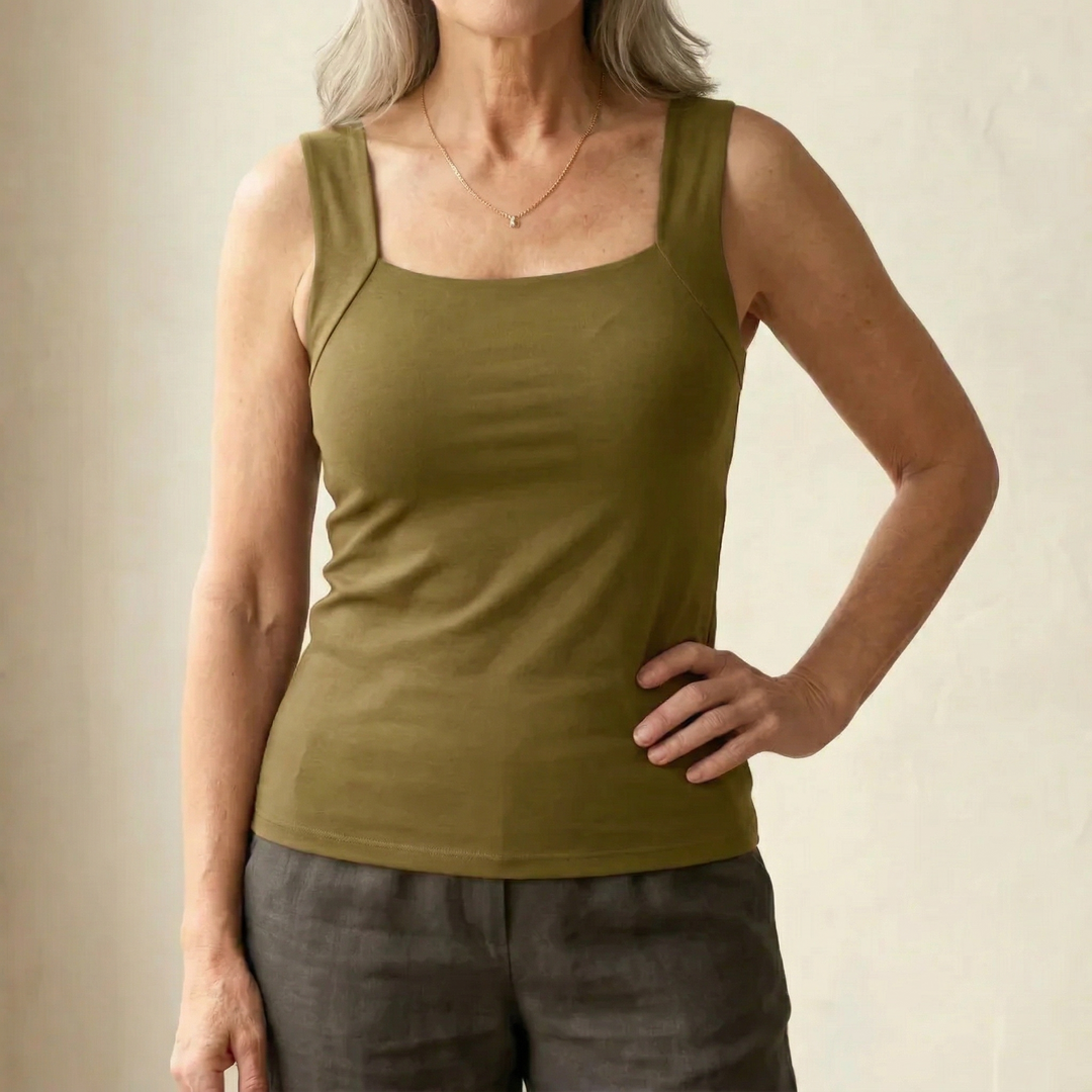 Women's layering tank top with built-in bra, providing wire-free support and seamless look.