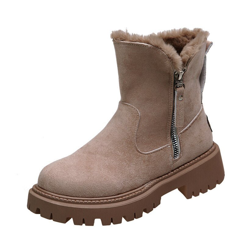 Warm women's black winter snow boots with traction, cozy slip-on design for ultimate comfort & style.