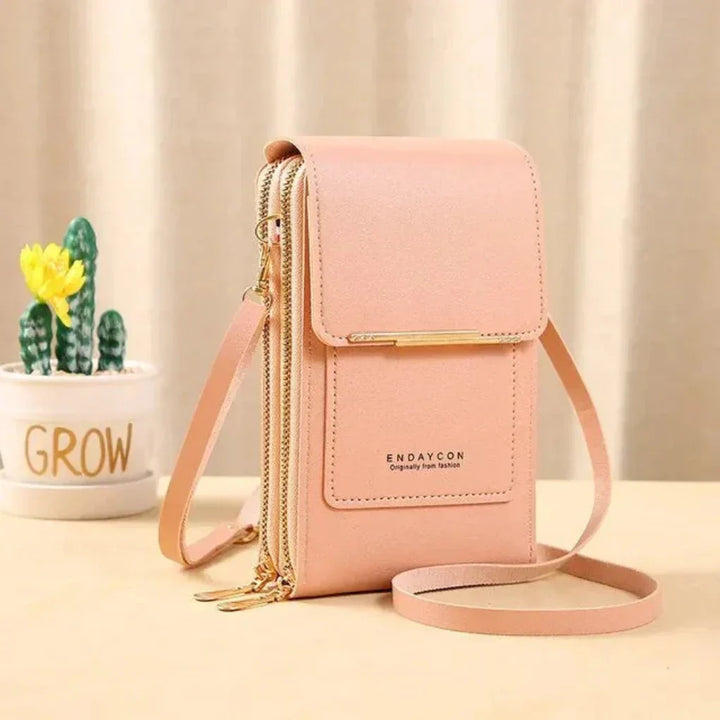 Modern women's fashion phone bag featuring an organized interior & accessible touchscreen window.