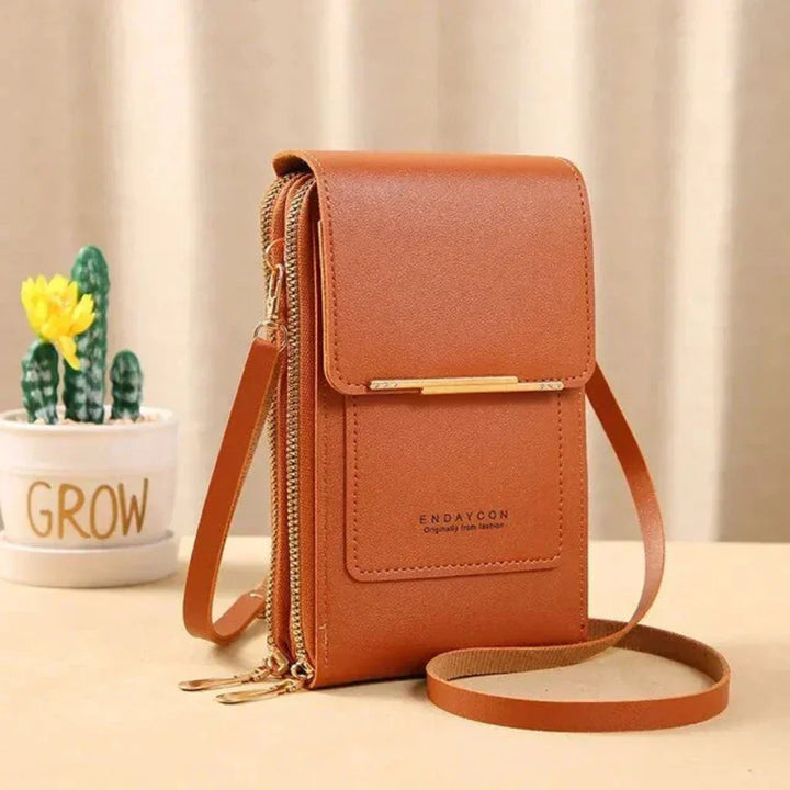 Versatile women's daily bag, a shoulder phone purse offering secure storage & easy smartphone use.