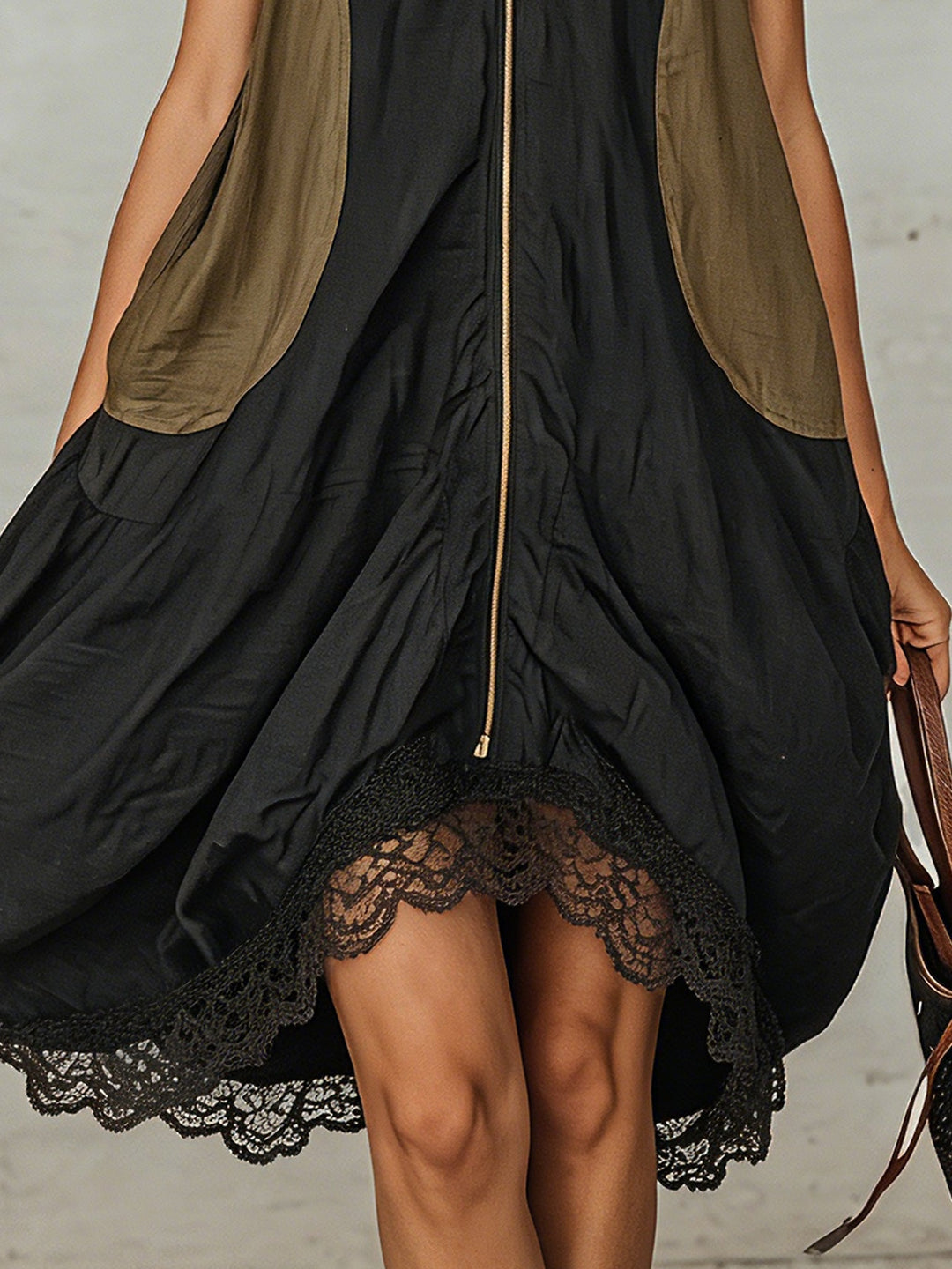 Stylish black V-neck midi dress for women, sleeveless, with a chic zip front and beautiful lace hem for summer.