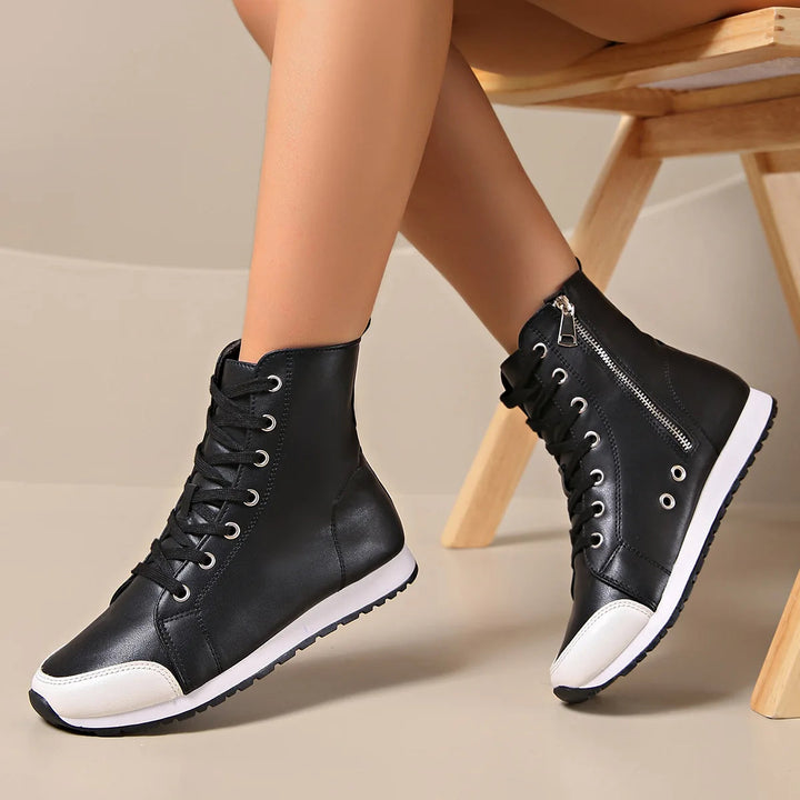 Women's black wide fit orthopedic lace-up sneakers, providing comfortable foot support for walking.
