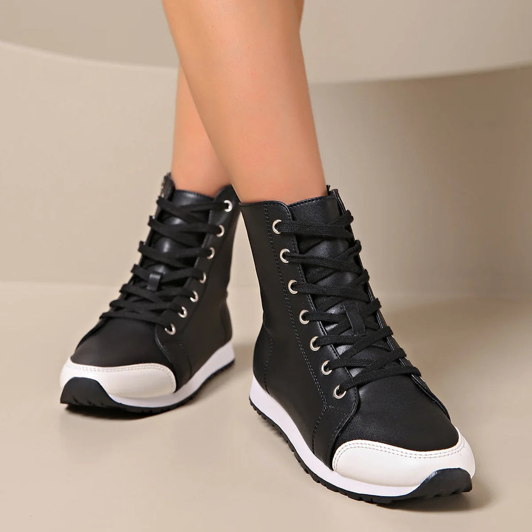 Supportive white wide fit women's lace-up sneakers, ideal for casual wear and all-day comfort.