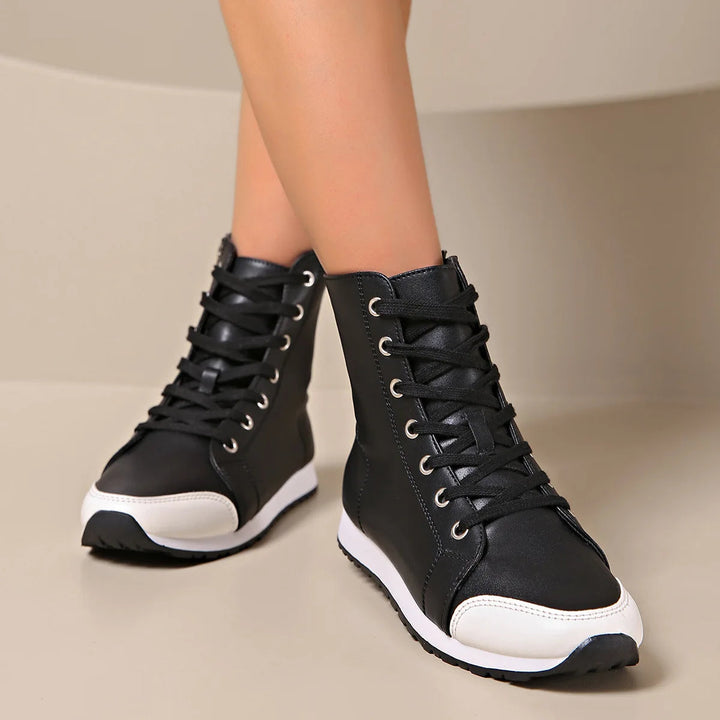 Supportive white wide fit women's lace-up sneakers, ideal for casual wear and all-day comfort.