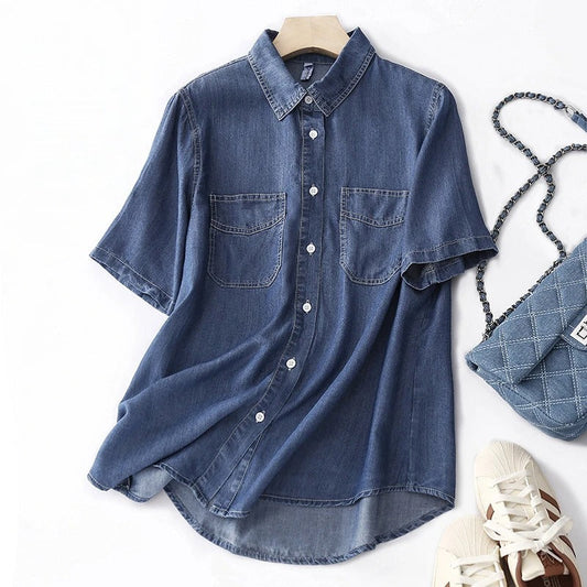 Women's blue long-sleeve button-up shirt with utility pockets. Perfect for casual everyday wear & versatile styling.