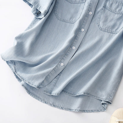 Stylish women's blue button-up shirt with long sleeves & utility pockets. A comfortable, versatile top for any season.