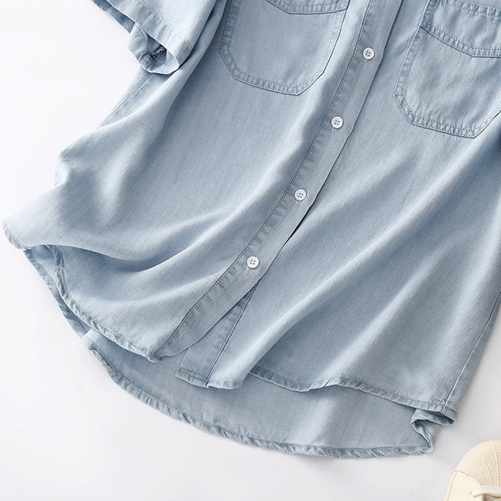 Stylish women's blue button-up shirt with long sleeves & utility pockets. A comfortable, versatile top for any season.