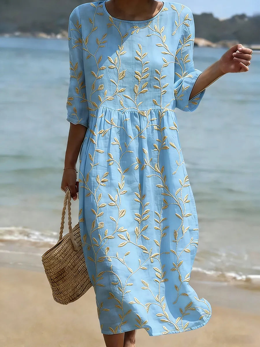 Women's blue midi dress with elegant leaf embroidery, three-quarter sleeves, perfect for summer casual elegance.