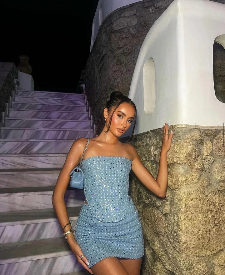 Shimmering blue sequin bodycon mini dress. Strapless design for a glamorous party or formal event.
