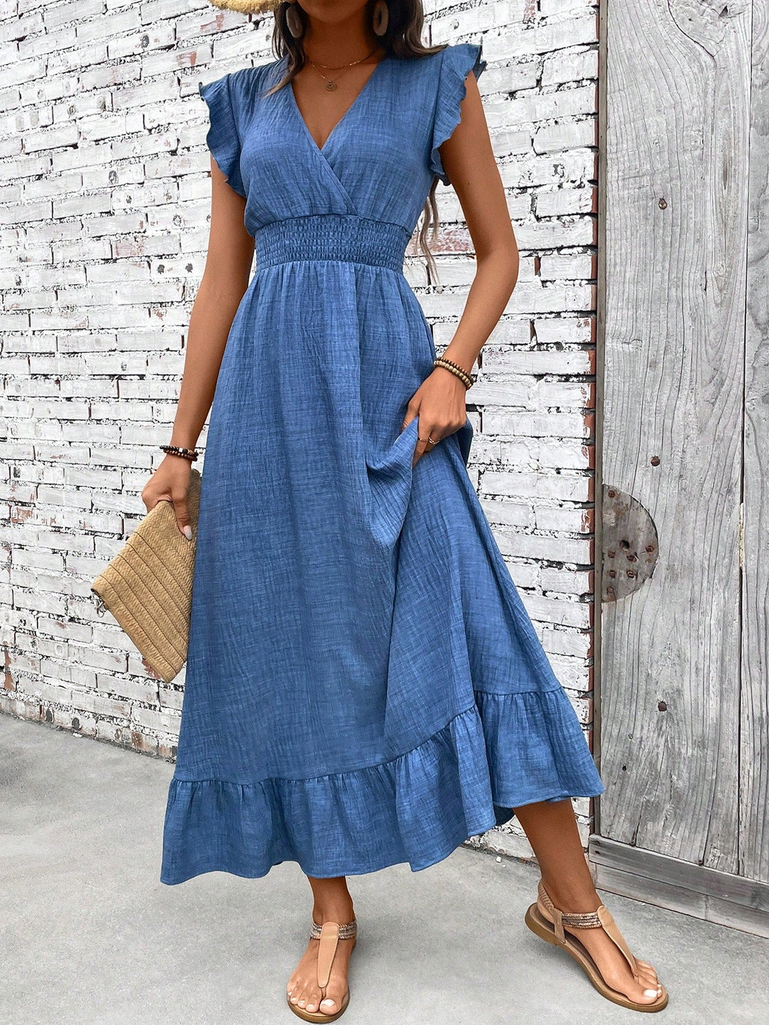 Women's blue smocked V-neck ruffle maxi dress. Effortless, flowy, and comfortable summer style, perfect for casual elegance.