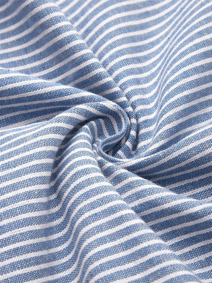 Elegant women's striped midi dress with unique side button details, short sleeves, and a comfortable relaxed fit.