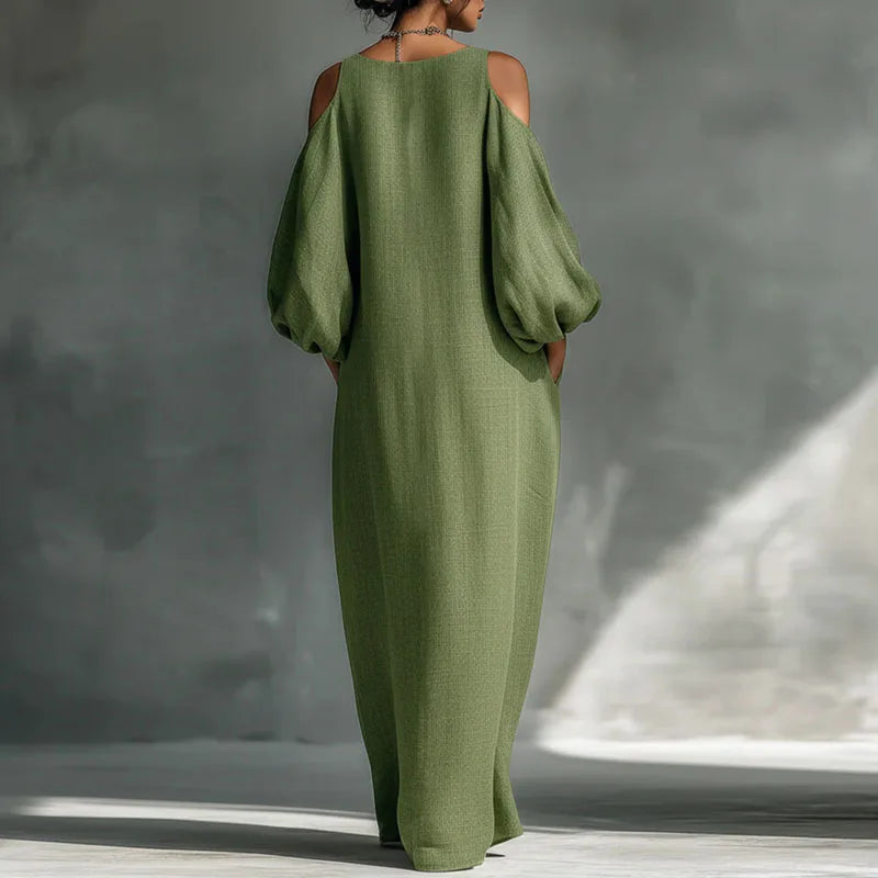 Flowing women's bohemian maxi dress with cold shoulder design, perfect for a relaxed yet elegant summer look.