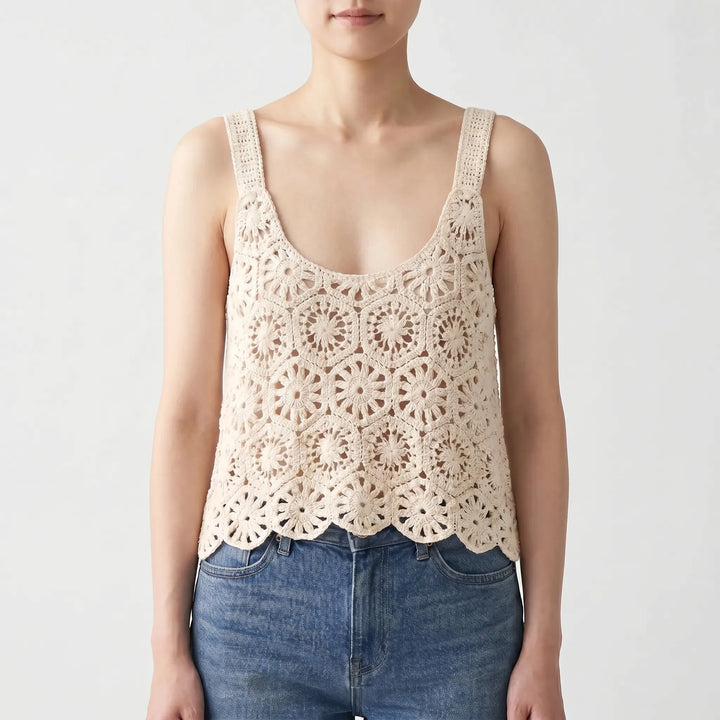 Hollow out knit beige crochet crop top for women. Perfect bohemian style sleeveless top for beach or summer fashion.