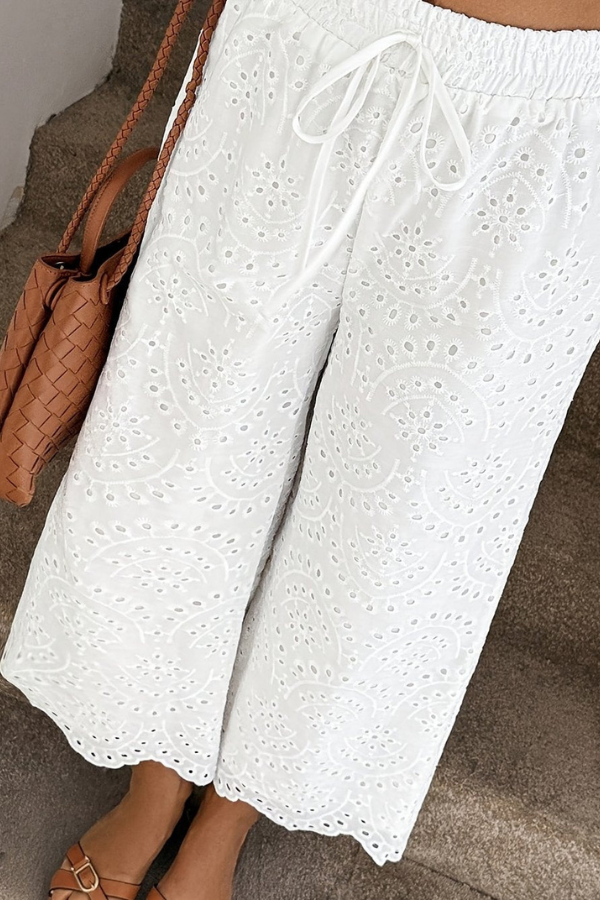 Stylish women's cropped summer pants, bohemian design, essential for vacation, beach, or casual wear.