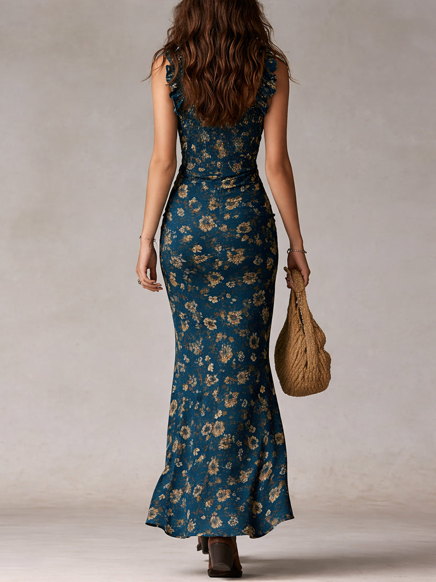 Vibrant women's floral boho maxi dress with a playful high slit & airy ruffled sleeves. Summer ready!