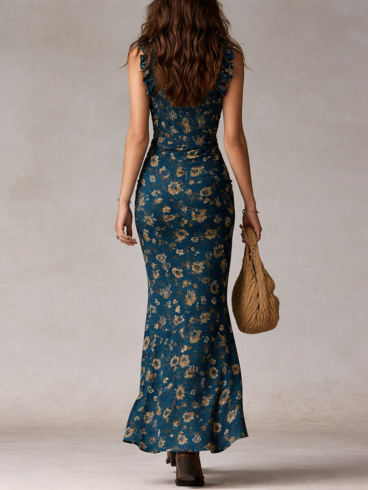 Vibrant women's floral boho maxi dress with a playful high slit & airy ruffled sleeves. Summer ready!