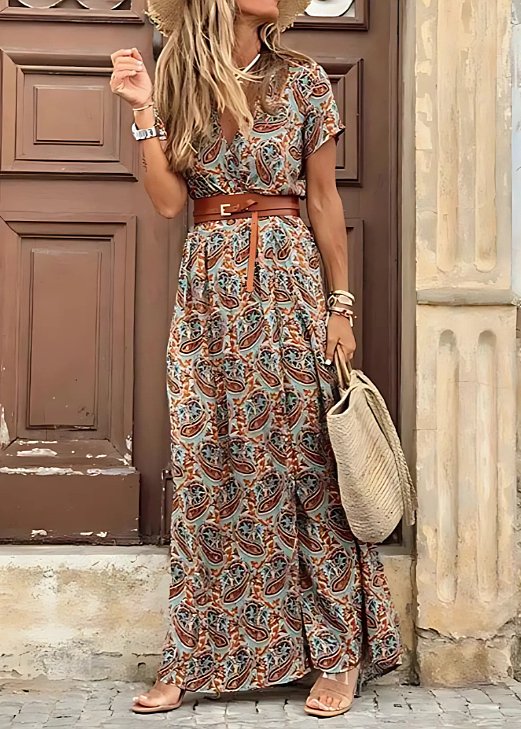 Flowy women's sleeveless V-neck Bohemian floral maxi dress with a side slit, great for warm weather & everyday wear.
