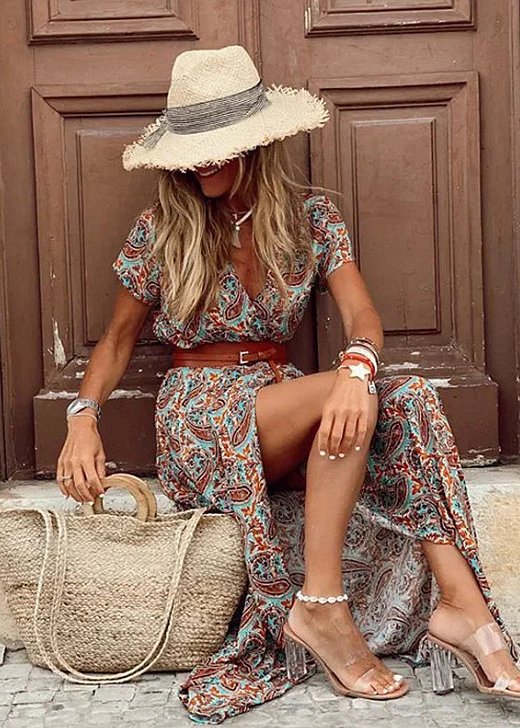 Stylish women's Bohemian floral print maxi dress, sleeveless V-neck design with a side slit, perfect for summer.