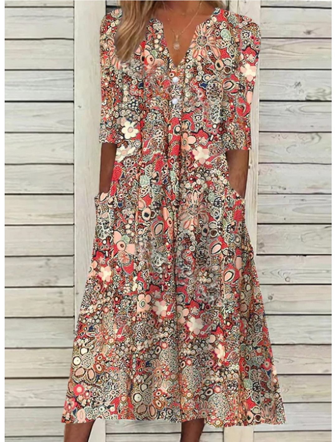 Women's bohemian floral print midi dress with relaxed fit, v-neck, and half sleeves, perfect for summer style.