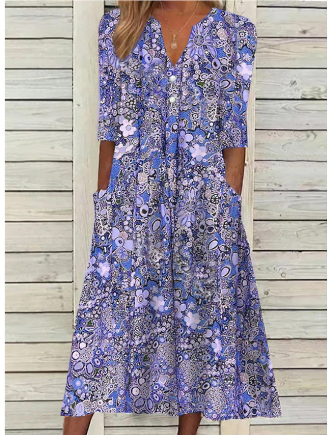 Relaxed fit women's bohemian floral midi dress, a stylish V-neck summer swing dress ideal for travel or casual wear.