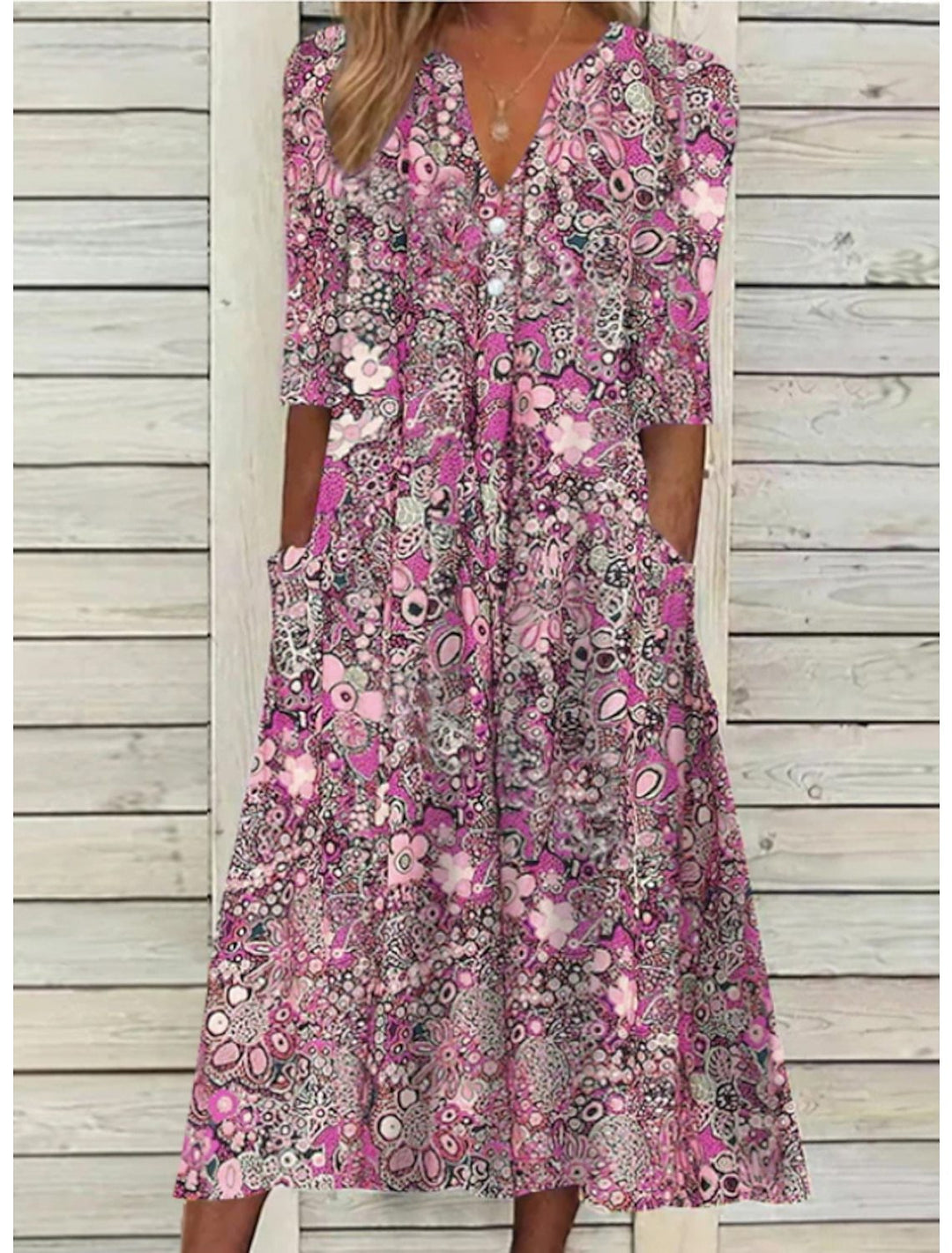 Chic women's floral print bohemian midi dress with half sleeves, designed for a comfortable and relaxed summer look.