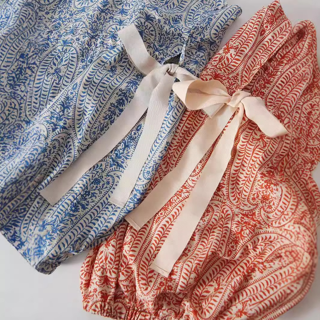 Women's relaxed fit bohemian floral pullover top with stylish balloon sleeves. Perfect casual folk style for spring/summer.