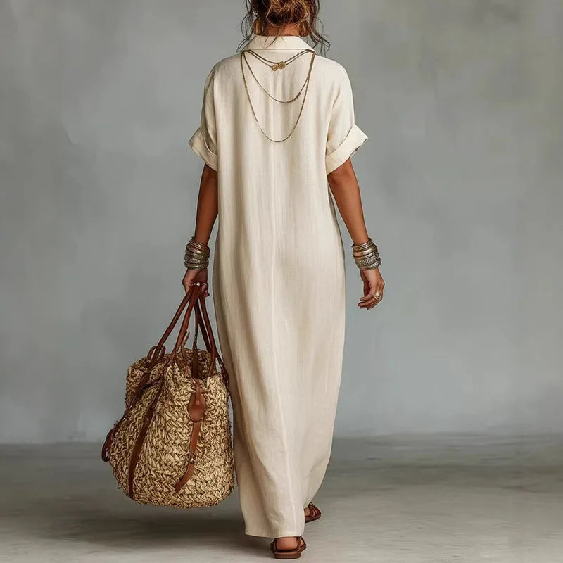 Flowing women's bohemian maxi dress with vibrant print & deep V-neck, comfortable for casual elegant summer style.