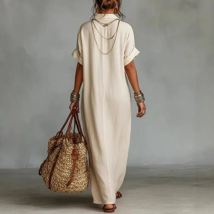 Flowing women's bohemian maxi dress with vibrant print & deep V-neck, comfortable for casual elegant summer style.