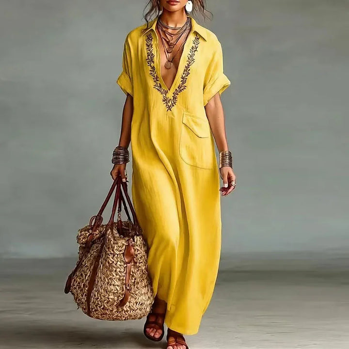 Stylish women's printed maxi dress, short sleeve & deep V-neck, ideal for bohemian summer and vacation.