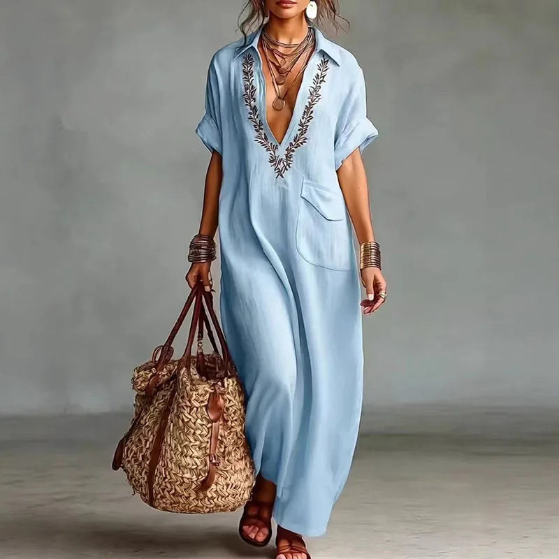 Comfortable women's bohemian printed maxi dress with deep V-neck and short sleeves, perfect for vacation wear.