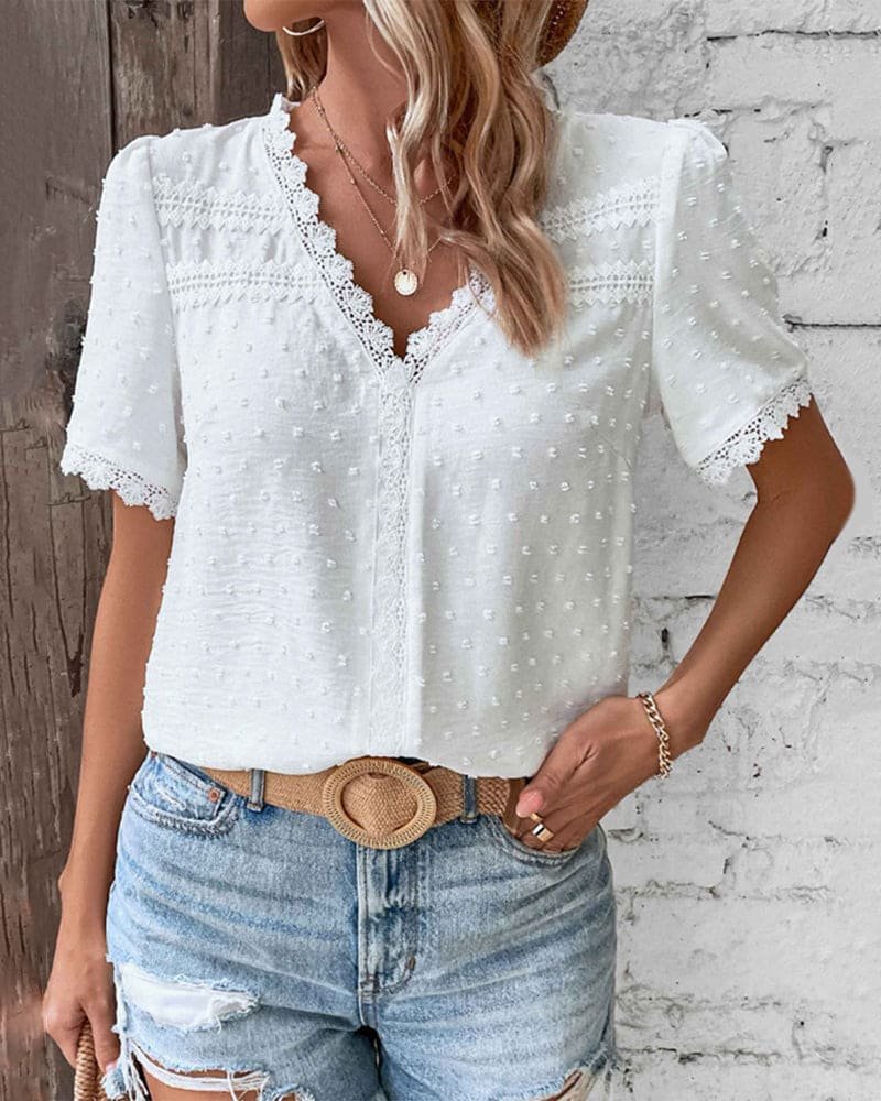 Elegant short-sleeve women's V-neck blouse featuring Swiss dot fabric and chic lace trim.