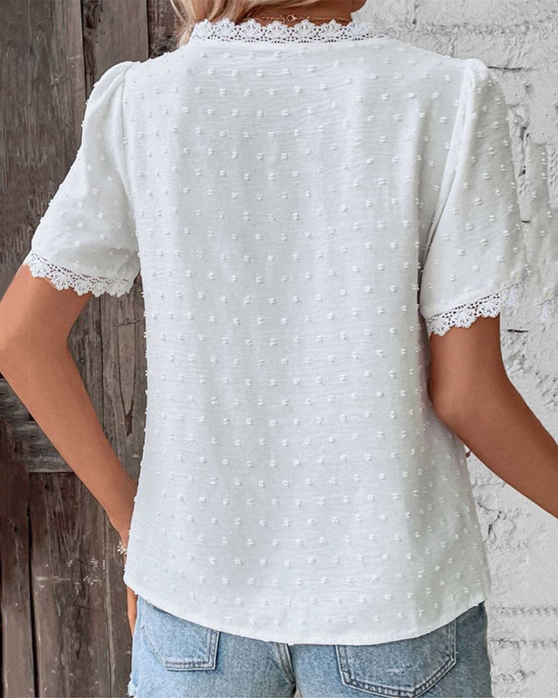 Casual women's Swiss dot top, V-neck, lace trim. Relaxed fit, bohemian style for summer.