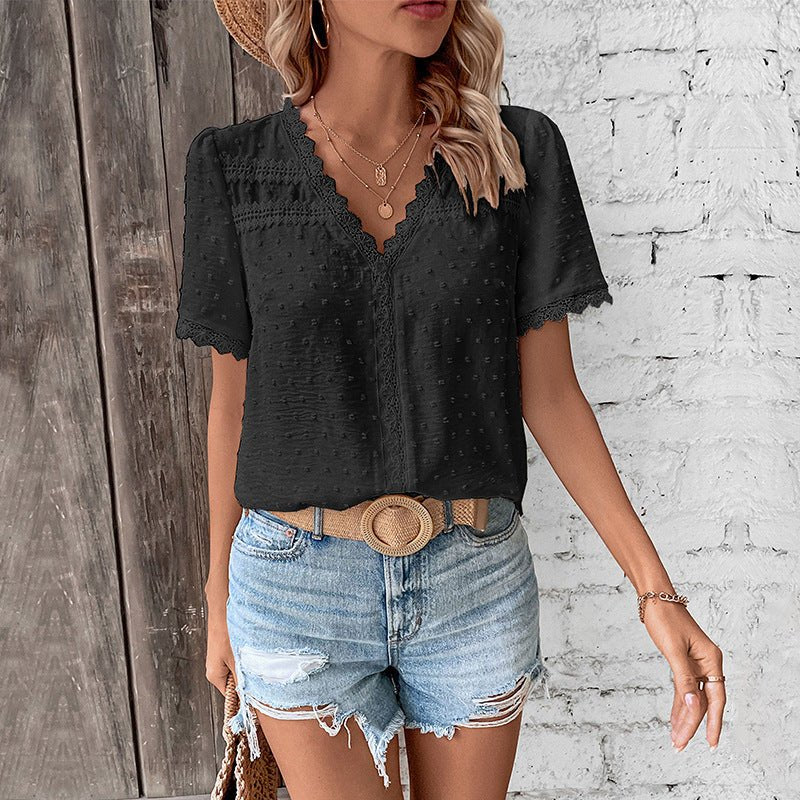Stylish women's V-neck Swiss dot top, lace trim. Bohemian casual blouse, perfect for spring fashion.