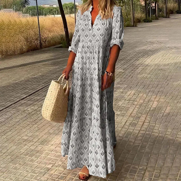 Flowy women's bohemian V-neck long sleeve maxi dress, relaxed fit for elegant casual style.