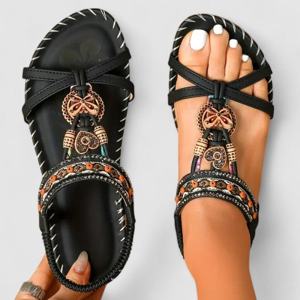 Ethnic embroidered flat sandals with tassels for women, ideal for bohemian summer style.