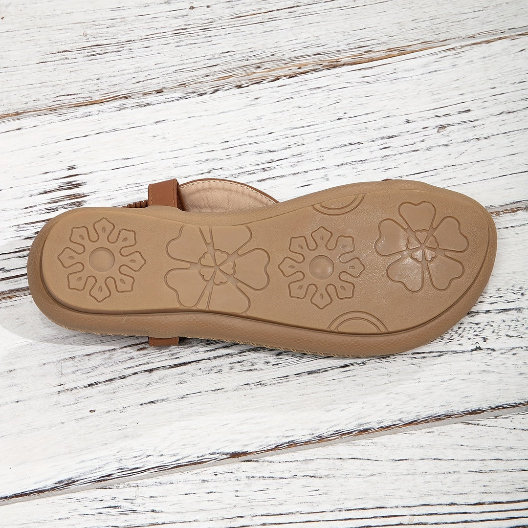 Summer essential: women's boho flat sandals with a beaded toe ring and eye-catching rhinestone details.